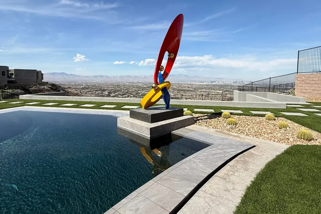 Homepage - Watters Aquatech Pool & Spa Pool with decorative sculpture overlooking landscape